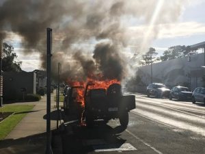 Car engulfed in flames outside cop shop