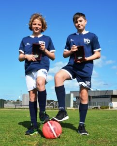 Futsal pair kicking goals