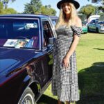 Alissa Larsen admiring the Ford Lincoln