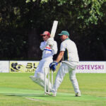 Mattg Pratt watches the ball go over the boundary to bring up his 100