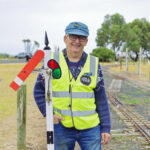 Railway volunteer, John Mander attending a signal